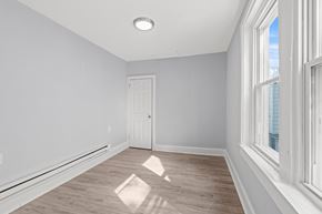 Philadelphia apartment for rent - A room with a white door and a window on the right side.