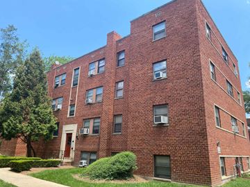 Washington apartment for rent - a red brick apartment building on a sunny day