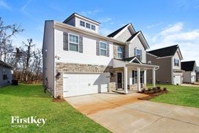 Greenville house for rent - A modern two-story house with a garage is showcased in the image.