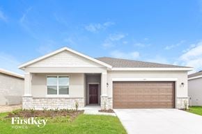 Bartow house for rent - a house with a garage door in front of it