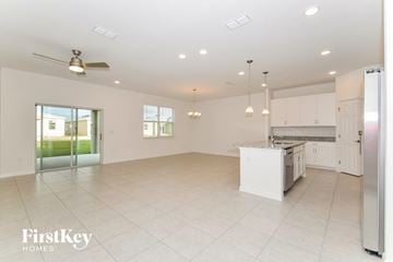 Bartow house for rent - a large kitchen with white cabinets and a white counter top