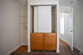 Ocean Springs apartment for rent - a bedroom with a dresser and a closet