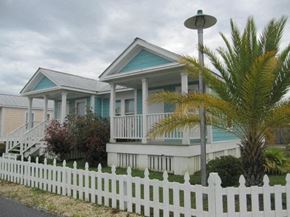 Ocean Springs apartment for rent - a blue and white house with a white picket fence