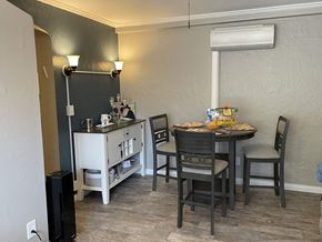 Dayton house for rent - a small kitchen and dining area with a table and chairs