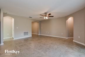 Winter Haven house for rent - the spacious living room with tile flooring and ceiling fan