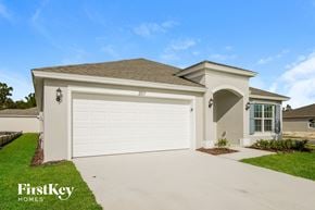 Winter Haven house for rent - A house with a garage door numbered 207 is for sale by FirstKey Homes.