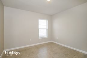 Winter Haven house for rent - a living room with a window and a tiled floor
