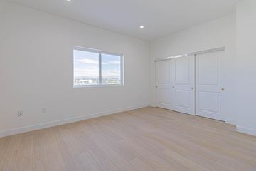 Inglewood apartment for rent - a living room with white walls and a window and wooden floors