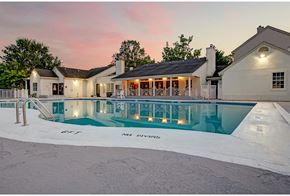 Monmouth Junction apartment for rent - a large swimming pool with a house in the background