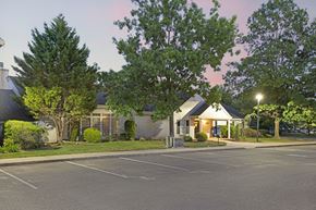 Monmouth Junction apartment for rent - a house with a parking lot and trees