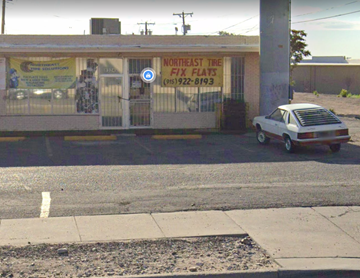 El Paso apartment for rent - A white car is parked in front of a tire shop.