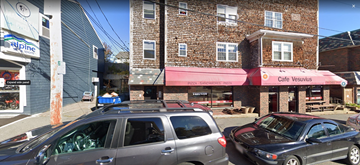 Marblehead apartment for rent - a city street with cars parked in front of a brick building
