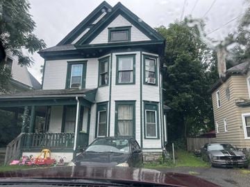Syracuse apartment for rent - a house with a car parked in front of it