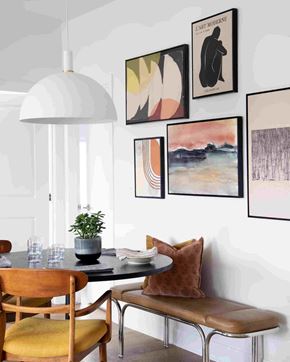 Ottawa apartment for rent - a dining room with a table and chairs and pictures on the wall
