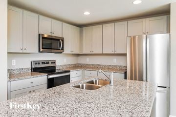 Davenport house for rent - A kitchen with granite countertops and stainless steel appliances.