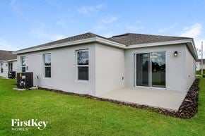Davenport house for rent - A house with a white exterior and a brown roof is shown.