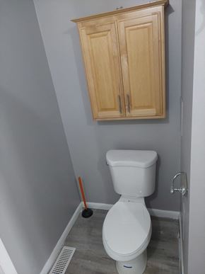 Morrow house for rent - a small bathroom with a toilet and a cabinet