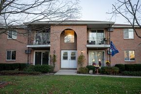 North Tonawanda apartment for rent - the front of a brick apartment building with a white door