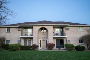 Niagara Falls apartment for rent - a brick house with a lawn in front of it