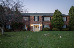 Niagara Falls apartment for rent - a large brick house with a lawn in front of it