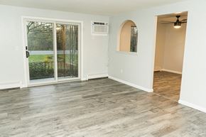 Niagara Falls apartment for rent - an empty living room with a sliding glass door