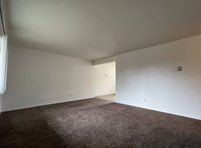 Longview apartment for rent - a empty room with carpet and white walls