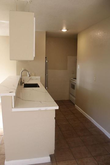 Houston apartment for rent - a kitchen with a counter top and a sink