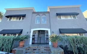 Long Beach apartment for rent - A house with a grey facade and a black awning.
