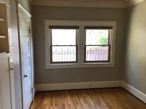 Long Beach apartment for rent - A room with a white door and a window with a view of a fence.
