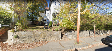 Marblehead apartment for rent - a stone retaining wall in front of a house