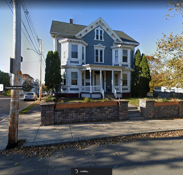 Salem apartment for rent - a blue house on the corner of a street
