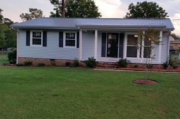 Fayetteville house for rent - A small house with a tree in front of it.