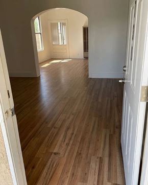 San Bernardino apartment for rent - A room with wooden floors and white walls.