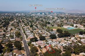 Riverside apartment for rent - an aerial view of the city of down town riverside and a neighborhood with buildings