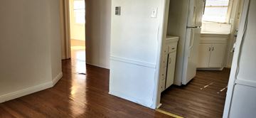 Los Angeles apartment for rent - a kitchen with a white refrigerator and a wooden floor