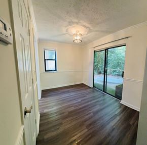 Dunwoody apartment for rent - A room with a sliding glass door and a window.