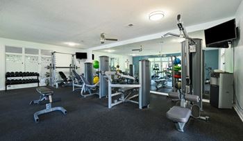 24-Hour fitness center with cardio and free weights