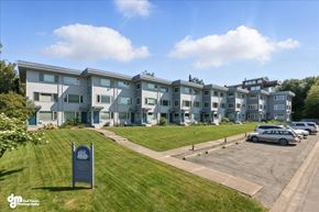 Anchorage apartment for rent - A row of modern houses with a sign in front of them.