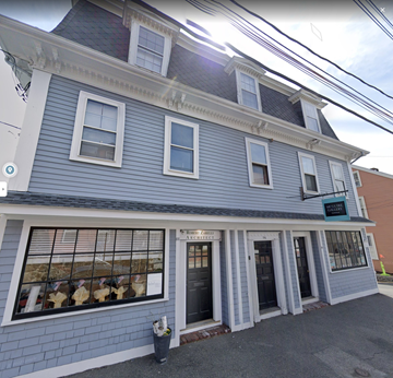 Marblehead apartment for rent - a blue and white building with a store in the front