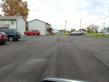 Warrensburg apartment for rent - a city street with cars parked on the side of it