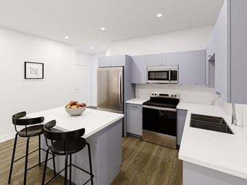 Winnipeg apartment for rent - A modern kitchen with a white countertop and stainless steel appliances.