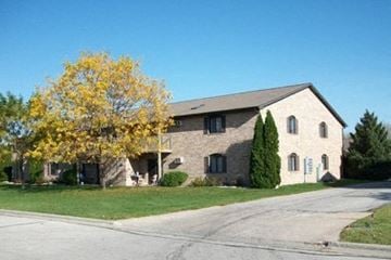 Green Bay apartment for rent - a brick house with a tree in front of it