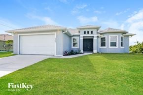 Lehigh Acres house for rent - A two-story house with a garage is for sale by FirstKey Homes.