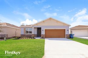 Bartow house for rent - A house with a garage door is for sale by FirstKey Homes.