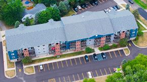 Utica apartment for rent - an aerial view of a building with cars parked in front of it