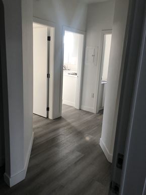 Vancouver apartment for rent - a view of the hallway from the living room into the bedroom and the bathroom