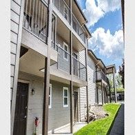 Spokane Valley apartment for rent - A building with a balcony and a fire extinguisher on the wall.