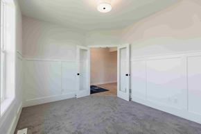 Blaine house for rent - a bedroom with white walls and white closets and carpet