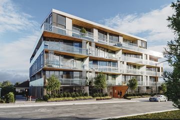 Vancouver apartment for rent - A modern multi-story residential building with balconies and glass windows.