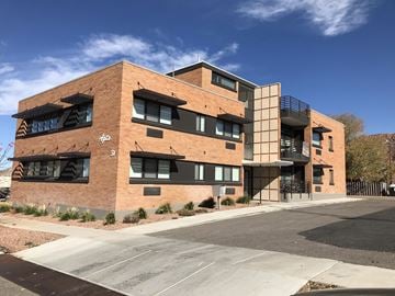 Cedar City apartment for rent - a brick building with a blue sky in the background
